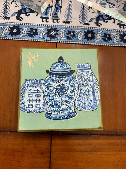 Blue vases on green